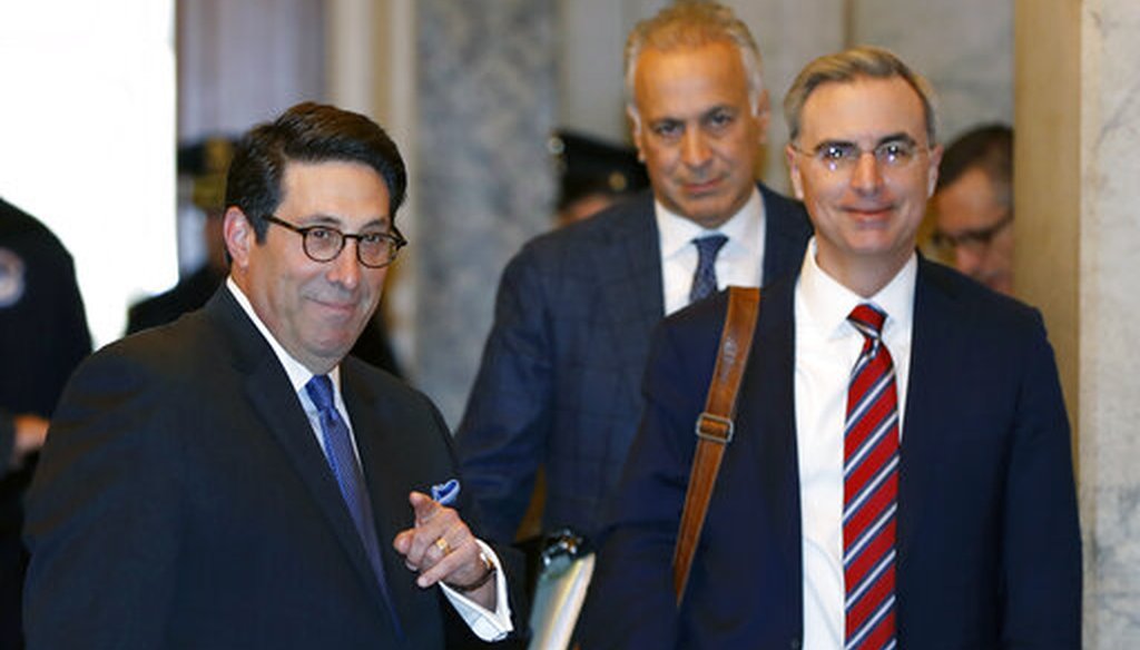President Donald Trump's personal attorney Jay Sekulow, left, stands beside White House Counsel Pat Cipollone, right, at the Capitol in Washington on Jan. 22, 2020. (AP/Cortez)