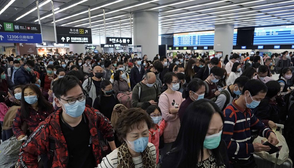 In this Thursday, Jan. 23, 2020 file photo, Passengers wear protective face masks at the departure hall of the high speed train station in Hong Kong. (AP)