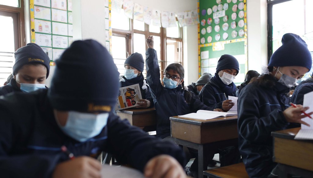 Students wear masks as a precautionary measure at Matribhumi school in Bhaktapur, Nepal, on Jan. 29, 2020. (AP)