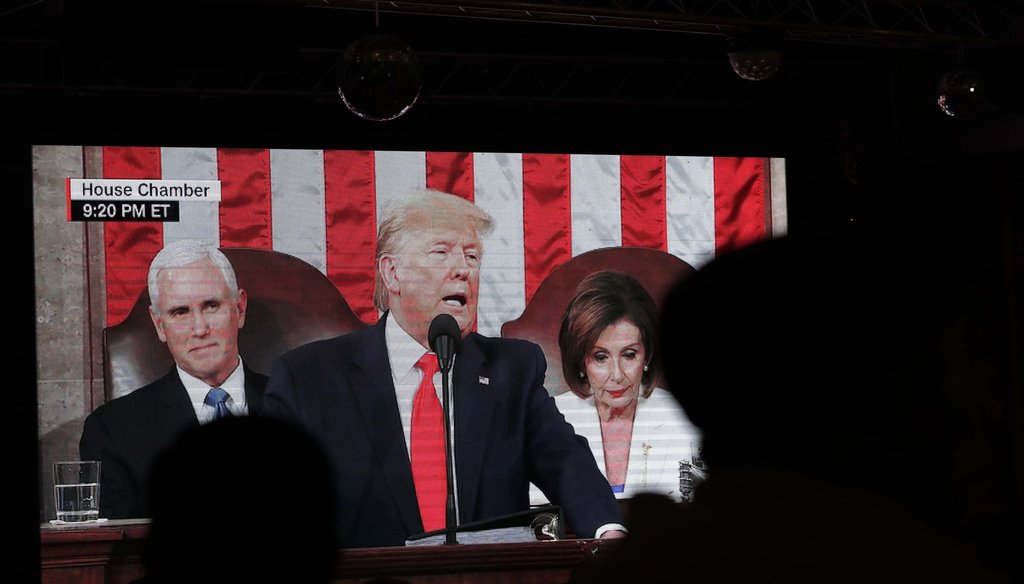 People watch as President Donald Trump delivers the State of the Union address to a joint session of Congress, during a watch party hosted by Miami Young Republicans and Trump Victory Miami on Feb. 4, 2020, in Coral Gables, Fla. (AP)