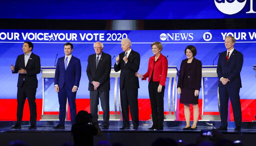 Democratic presidential candidates on stage Friday, Feb. 7, 2020, before the start of a primary debate hosted by ABC News, Apple News, and WMUR-TV at Saint Anselm College in Manchester, N.H. (AP/Charles Krupa)