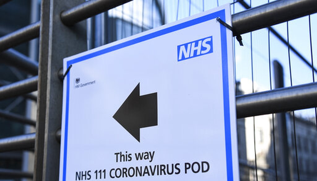 A sign indicating a coronavirus pod is seen outside the London University College Hospital in London on Friday, March 6, 2020. (AP/Pezzali)