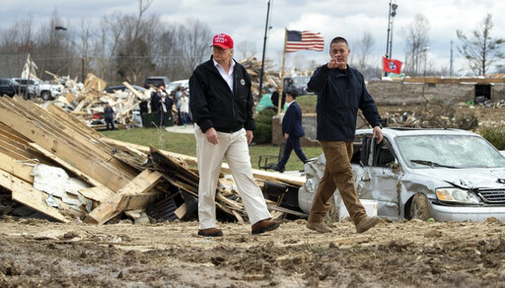 President Donald Trump speaks with Mike Herrick, with Putnam County Rescue Squad, as he tours damage from a tornado on March 6, 2020, in Cookeville, Tenn. (AP)