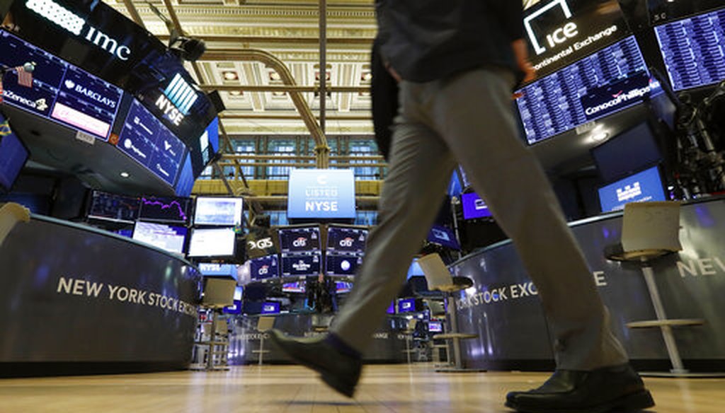 A trader walks across the floor of the New York Stock Exchange on March 9, 2020. (AP/Drew)