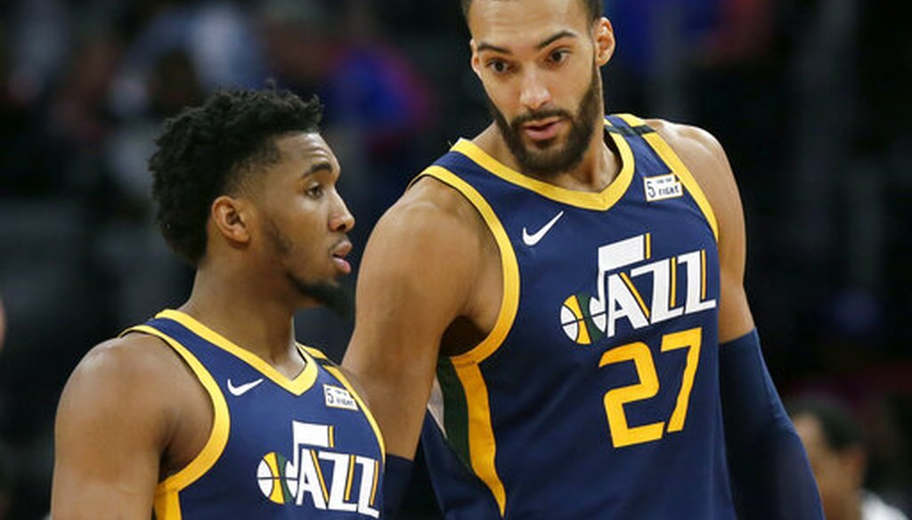 Utah Jazz center Rudy Gobert talks with guard Donovan Mitchell, left, during an NBA basketball game against the Detroit Pistons, in Detroit, on March 7, 2020. (AP/Burleson)