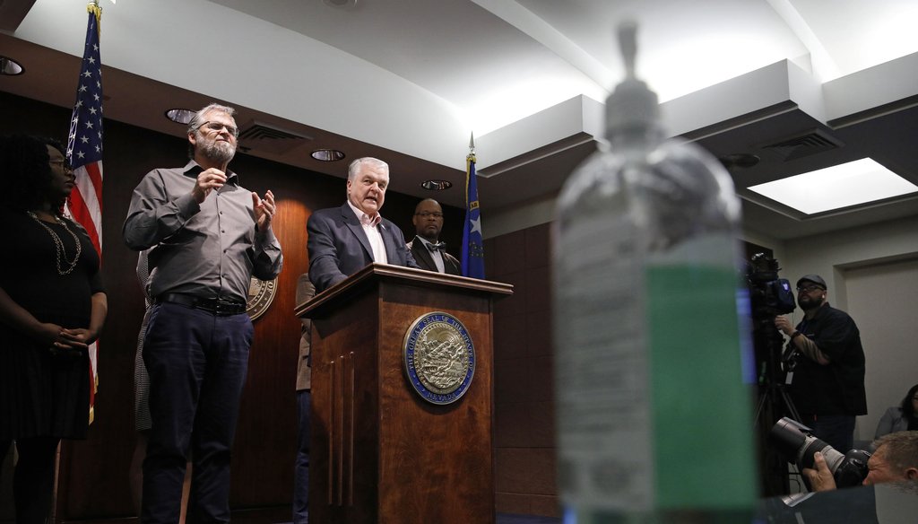 With a bottle of hand sanitizer on a table, foreground, Nevada Gov. Steve Sisolak announces a state of emergency amid coronavirus fears at a news conference on March 12, 2020, in Las Vegas. (AP)