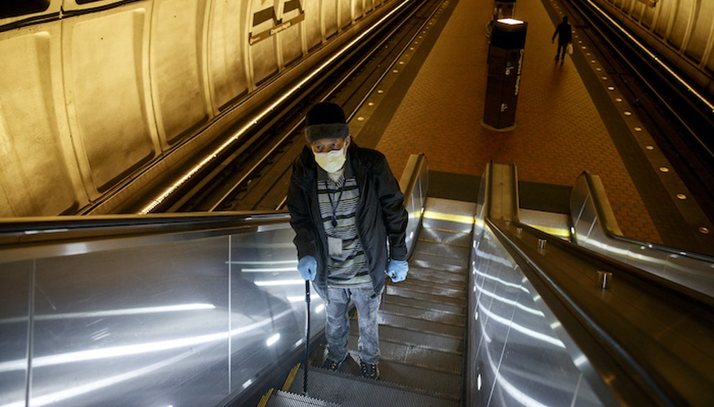 Andre of Washington, D.C., rides the escalator up at the Metro subway Congress Heights train station in Washington, Friday, March, 13, 2020. (Associated Press)