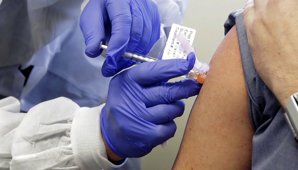 Neal Browning receives a shot in the first-stage safety study clinical trial of a potential vaccine for COVID-19, the disease caused by the new coronavirus on March 16, 2020, at the Kaiser Permanente Washington Health Research Institute in Seattle. (AP)