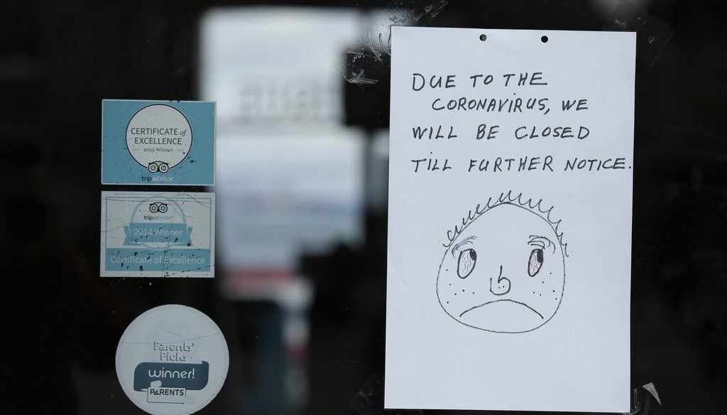 A closed sign is posted to the entrance of the Musée Mécanique penny arcade at Fisherman's Wharf on March 16, 2020, in San Francisco.