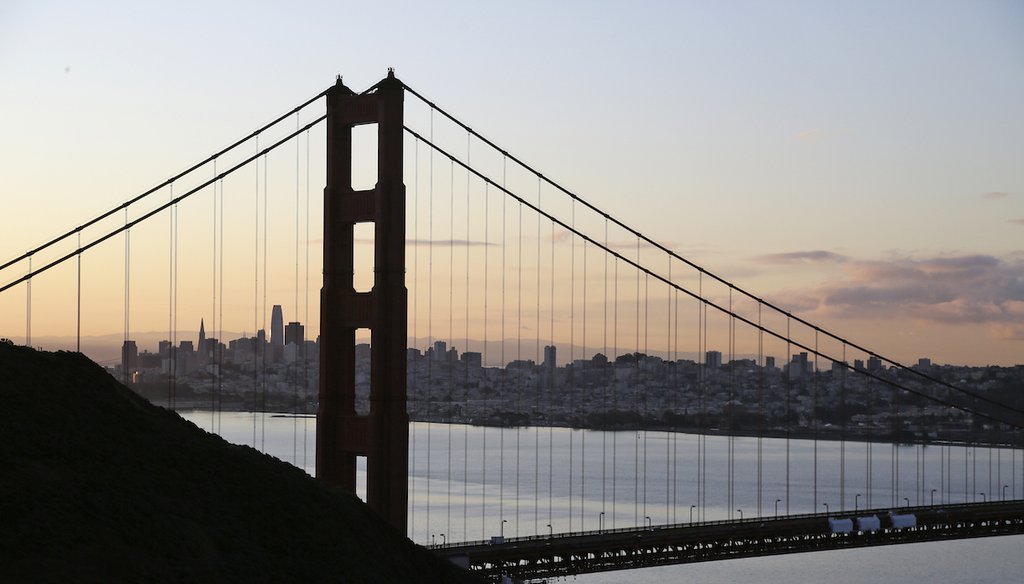 The San Francisco skyline is seen shortly after sunrise behind the Golden Gate Bridge on March 17, 2020, in Sausalito, Calif. (AP)