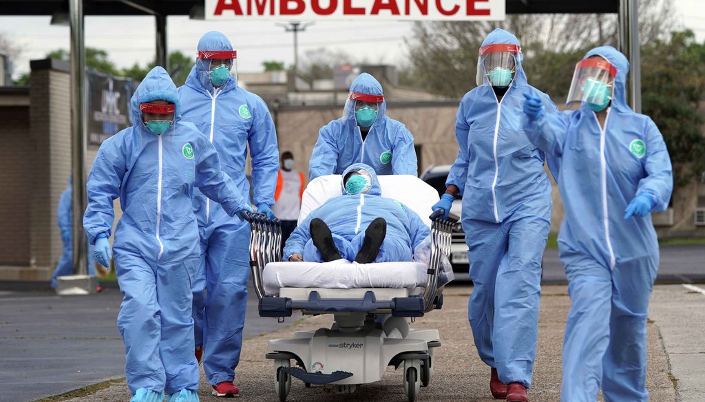 A person is taken on a stretcher into the United Memorial Medical Center after going through testing for COVID-19 on March 19, 2020, in Houston. (AP)