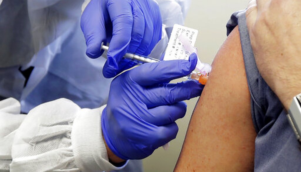 Neal Browning receives a shot in the first-stage study of a potential vaccine for COVID-19 on March 16, 2020, in Seattle. (AP)