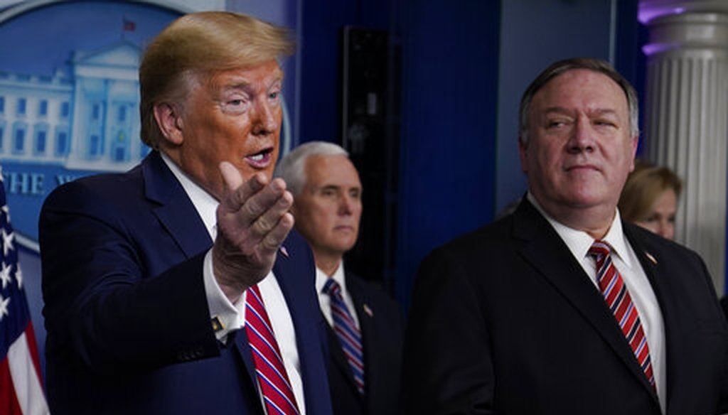 Secretary of State Mike Pompeo listens as President Donald Trump speaks during a coronavirus task force briefing at the White House on March 20, 2020, in Washington. (AP/Vucci)