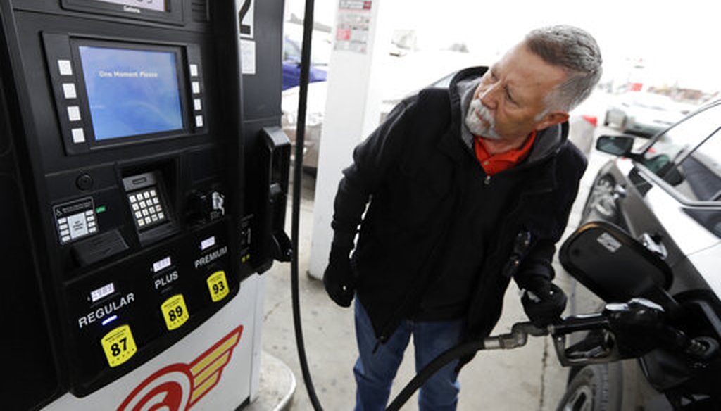 Julio DeJesus pumps gas for 98.9 cents a gallon on March 30, 2020, in Cleveland. (AP)