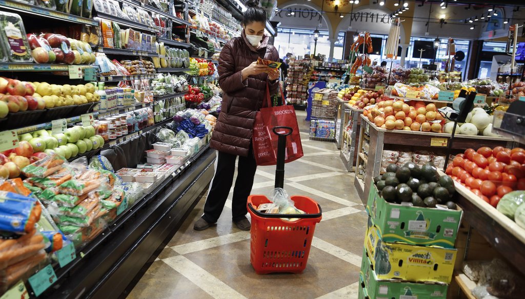 A shopper wears a face mask in the produce section of a grocery store April 18, 2020, in the Harlem neighborhood of the Manhattan borough of New York, during the coronavirus outbreak. (AP)