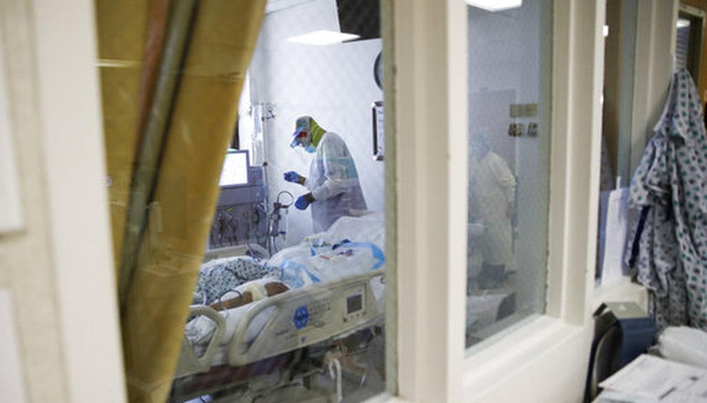 An intensive care unit staff member cares for a COVID-19 patient on April 20, 2020, at St. Joseph's Hospital in Yonkers, N.Y. (AP/Minchillo)