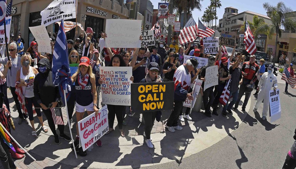 In this April 17, 2020, file photo, protesters demonstrate against stay-at-home orders that were put in place due to the COVID-19 outbreak, in Huntington Beach, Calif. (AP)