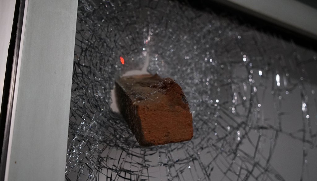 A brick protrudes from a shattered window in downtown Raleigh, N.C., on June 1, 2020. (AP)