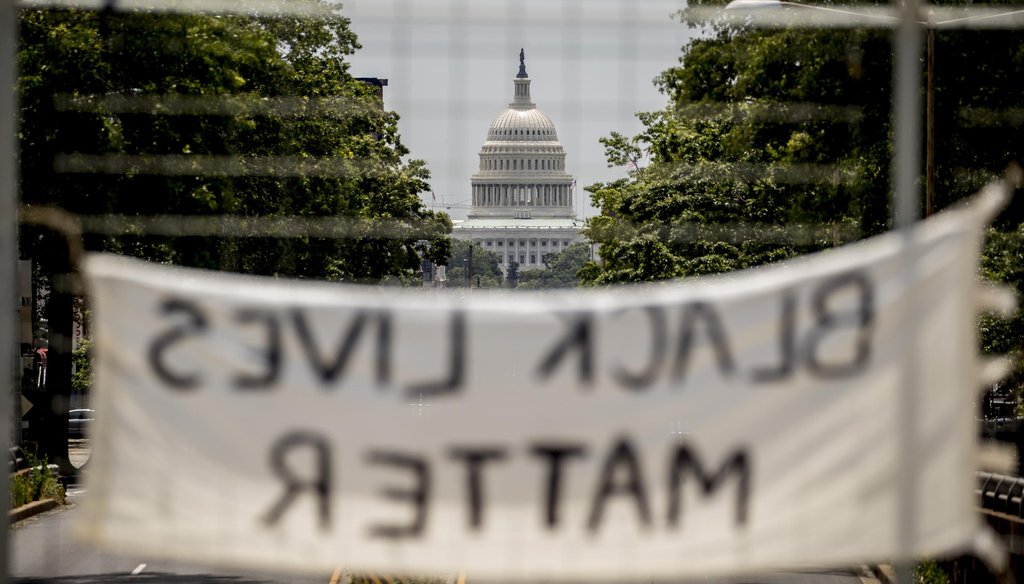 The dome of the U.S. Capitol is visible as a sign that reads "Black Lives Matter" hangs on an overpass on North Capitol Street in Washington on June 2, 2020. (AP)