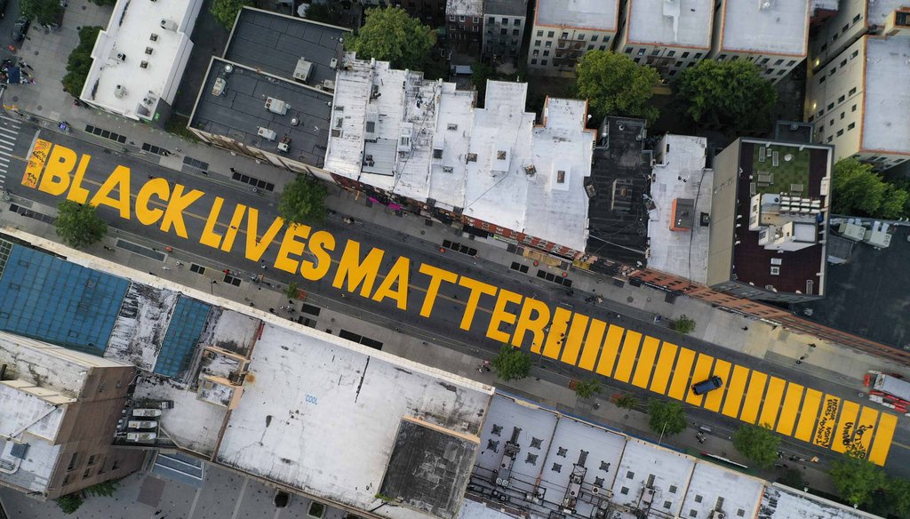 A giant "BLACK LIVES MATTER" sign is painted in orange on Fulton Street on June 15, 2020, in the Brooklyn borough of New York. (AP)