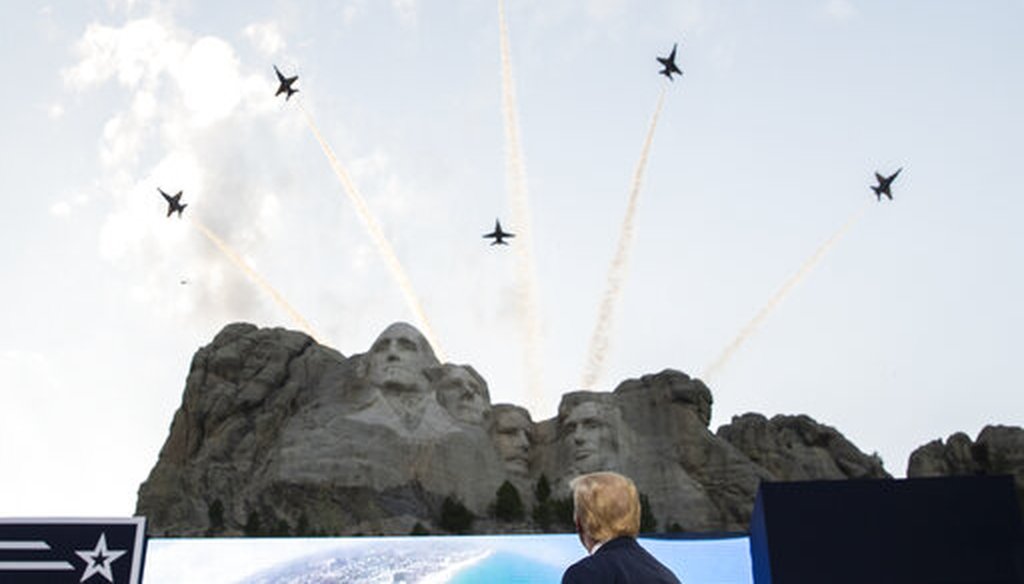 President Donald Trump watches a flyover by the U.S. Navy Blue Angels at Mount Rushmore National Memorial on July 3, 2020. (AP)