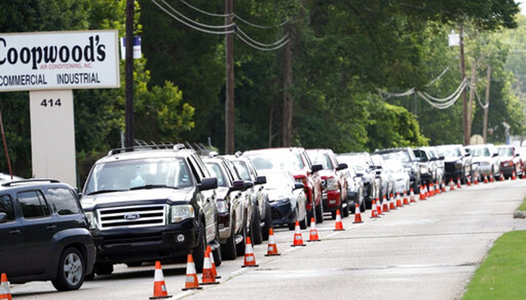 People wait inside their vehicles in line at COVID-19 testing site on July 8, 2020, in Houston. (AP)