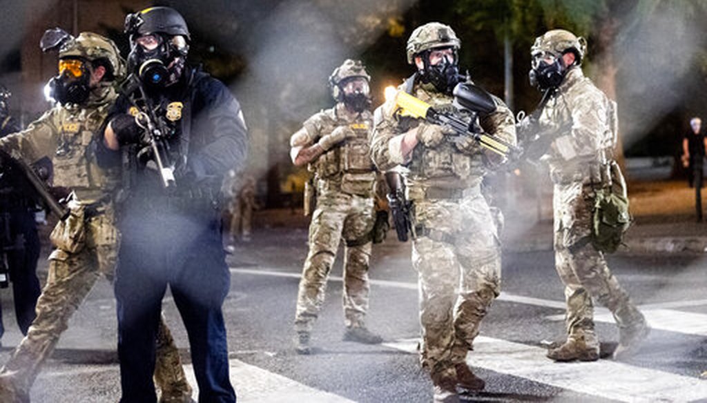 Federal agents disperse protesters near the Mark O. Hatfield United States Courthouse on July 20, 2020, in Portland, Ore. (AP/Berger)