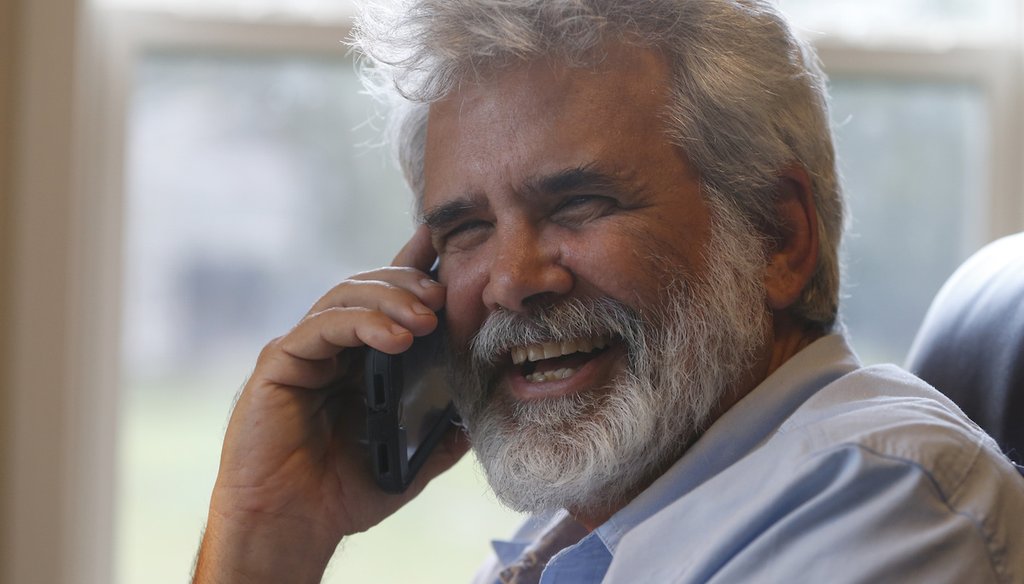 Dr. Robert Malone talks on his phone as he works from a home office in Madison, Va., on July 22, 2020. (AP)