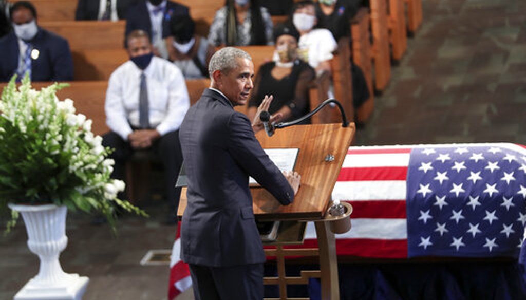 Former President Barack Obama eulogizes Rep. John Lewis at Ebenezer Baptist Church in Atlanta, July 30. (Alyssa Pointer/Atlanta Journal-Constitution via AP)