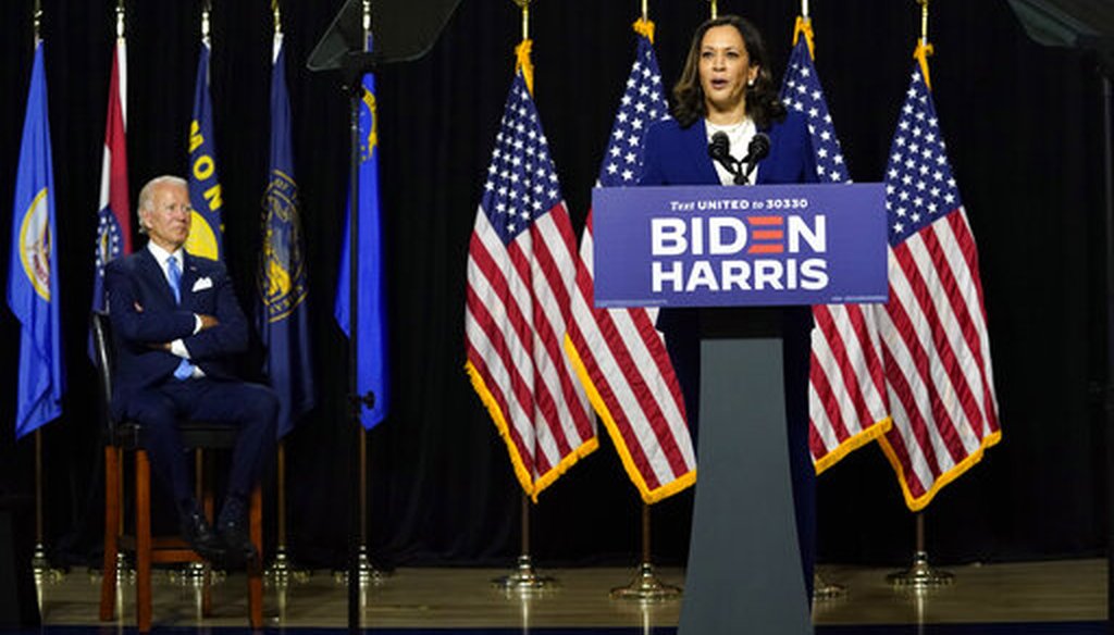 Democratic presidential candidate and former Vice President Joe Biden listens as his running mate, Sen. Kamala Harris, D-Calif., speaks during a campaign event at Alexis Dupont High School in Wilmington, Del., on Aug. 12, 2020. (AP/Kaster)