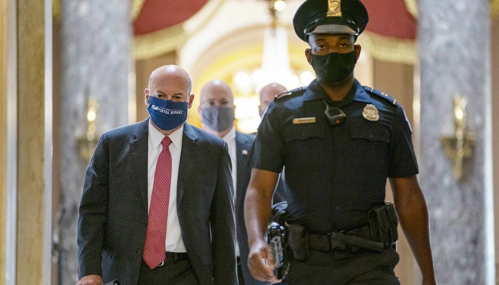 In this Aug. 5, 2020, file photo Postmaster General Louis DeJoy, left, is escorted to House Speaker Nancy Pelosi's office on Capitol Hill in Washington. (AP)