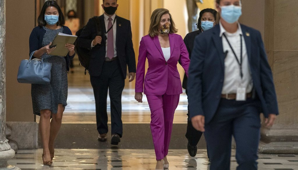 House Speaker Nancy Pelosi of Calif., center, walks to her office on Sept. 14, 2020, on Capitol Hill in Washington. (AP)