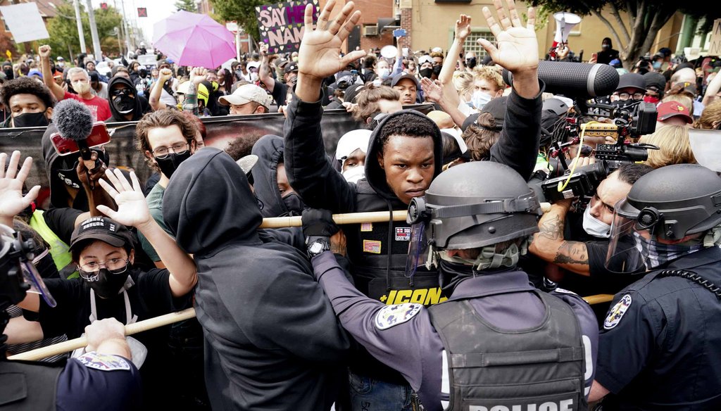 Police and protesters converge during a demonstration on Sept. 23, 2020, in Louisville, Ky. (AP)