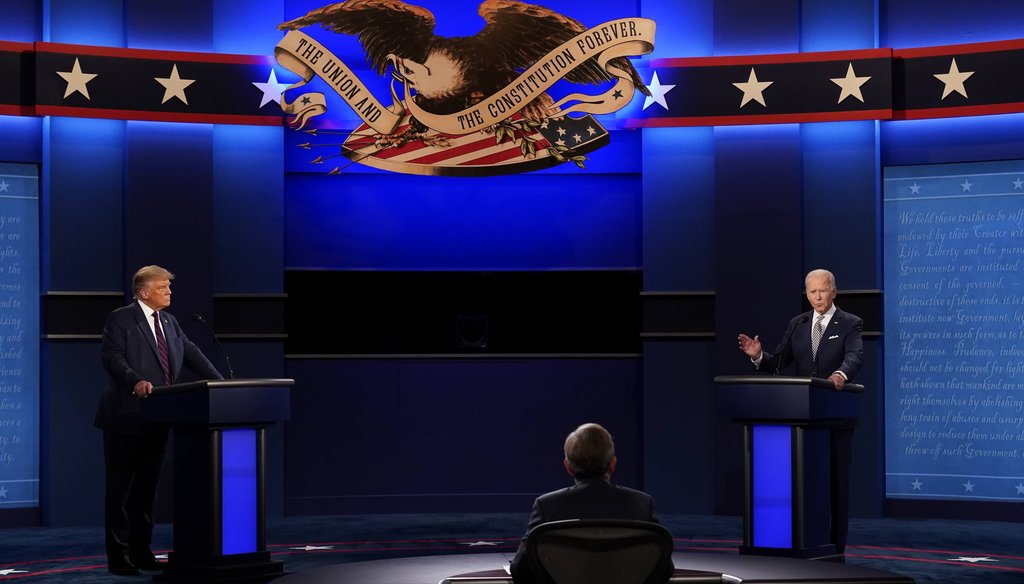 President Donald Trump, left, and Democratic presidential candidate former Vice President Joe Biden, right, with moderator Chris Wallace, center, of Fox News during the first presidential debate on Sept. 29, 2020. (AP)