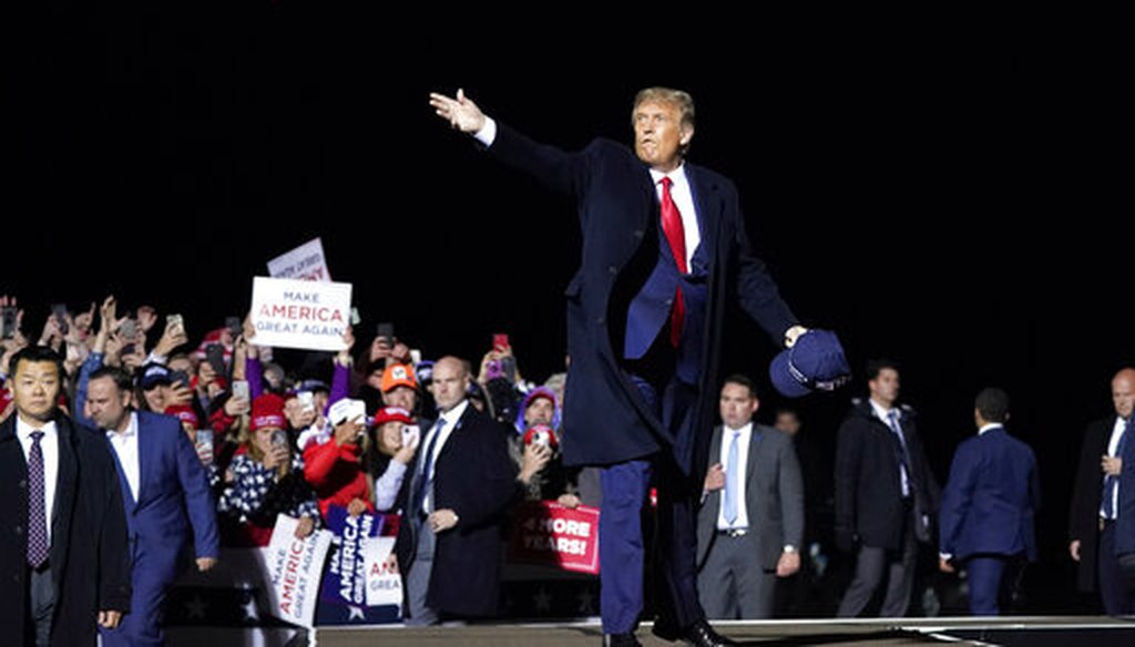 President Donald Trump throws hats to supporters after speaking at a campaign rally at Duluth International Airport, Sept. 30, 2020, in Duluth, Minn. (AP/Alex Brandon)