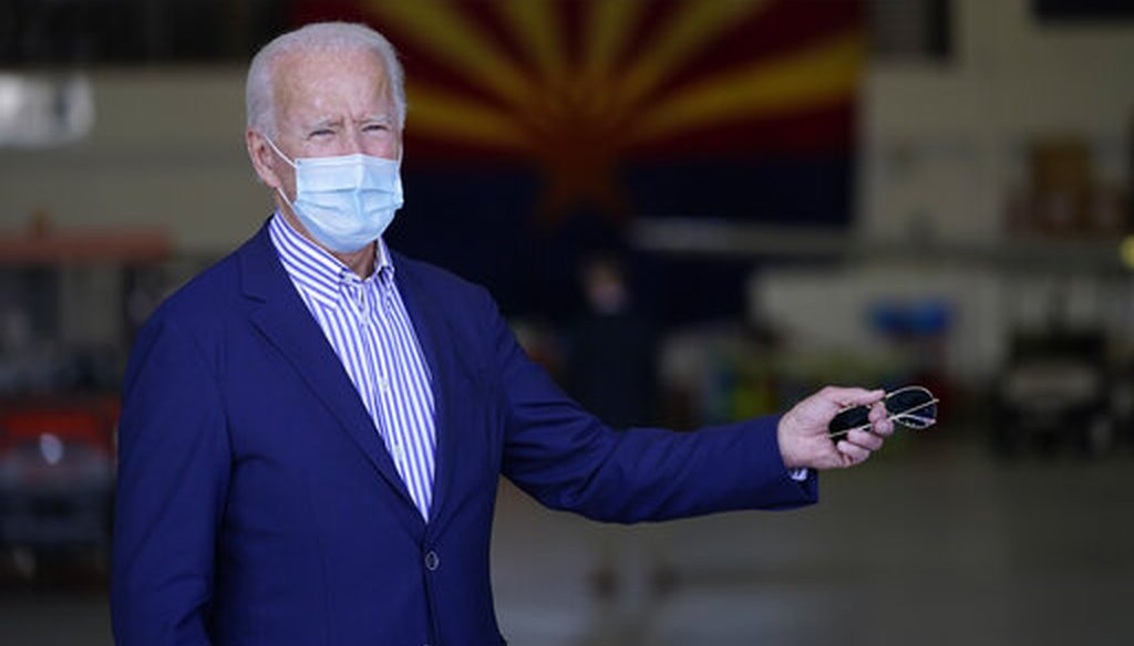 Democratic presidential candidate Joe Biden takes questions at a hangar in Phoenix, Oct. 8, 2020. (AP)