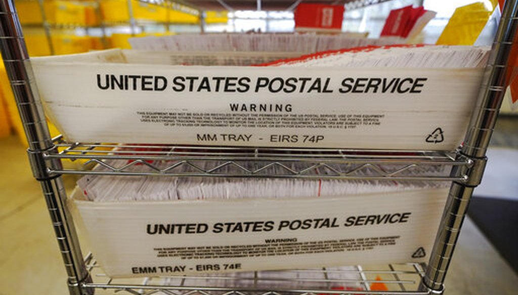 Mailed ballots fill U.S. Postal Service trays at the King County Elections office on Nov. 3, 2020, in Renton, Wash. (AP/Warren)