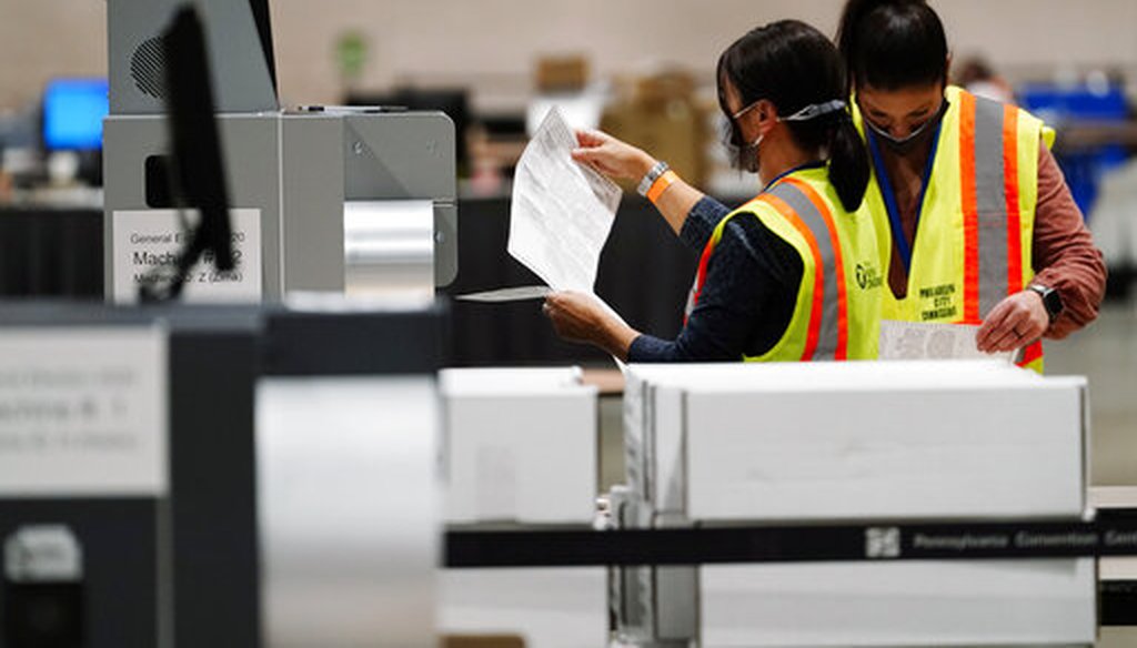 Philadelphia election workers scan in ballots for the general election, at the Pennsylvania Convention Center, Tuesday, Nov. 3, 2020, in Philadelphia. (AP)