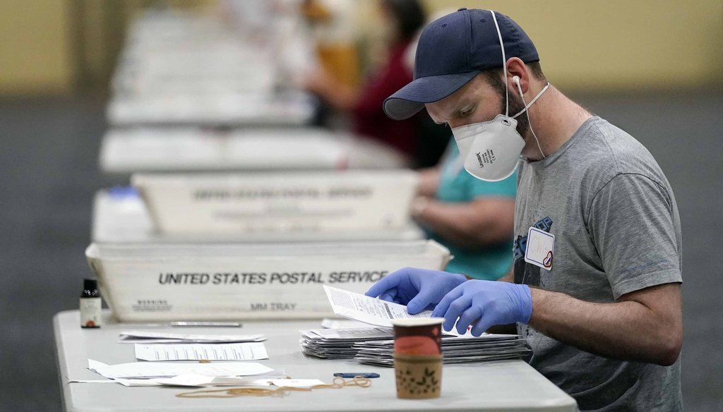 Workers prepare mail-in ballots for counting on Nov. 4, 2020, at the convention center in Lancaster, Pa., following Tuesday's election. (AP)