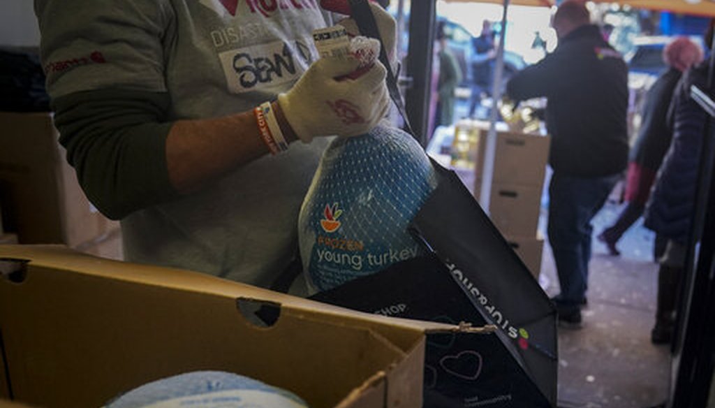 A volunteer bag turkeys at Harlem's Food Bank For New York City, a community kitchen and food pantry, on Nov. 16, 2020, in New York. (AP/Matthews)