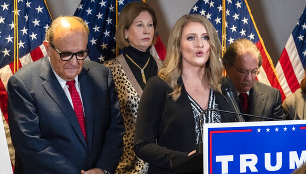 Members of President Donald Trump's legal team, including former Mayor of New York Rudy Giuliani, left, Sidney Powell, and Jenna Ellis, hold a news conference on Nov. 19, 2020. (AP)