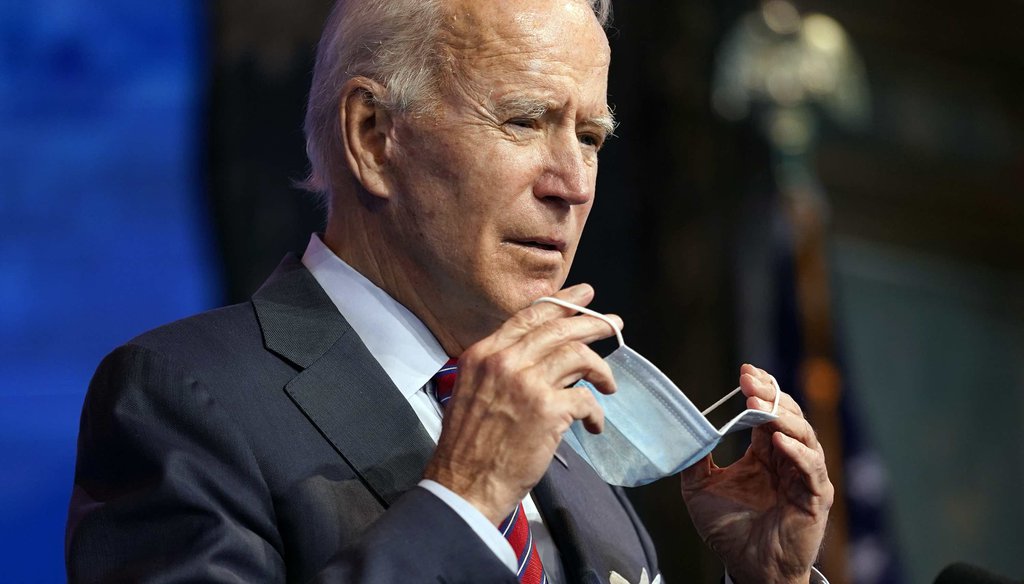 President-elect Joe Biden puts on his face mask after speaking about jobs at The Queen theater on Dec. 4, 2020, in Wilmington, Del. (AP)