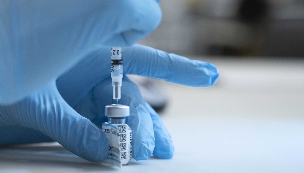 UC Davis Medical Center nurse Heather Donaldson prepares to inoculate a staff member with the Pfizer-BioNTech COVID-19 vaccine Dec. 15, 2020 in Sacramento, Calif. (AP)