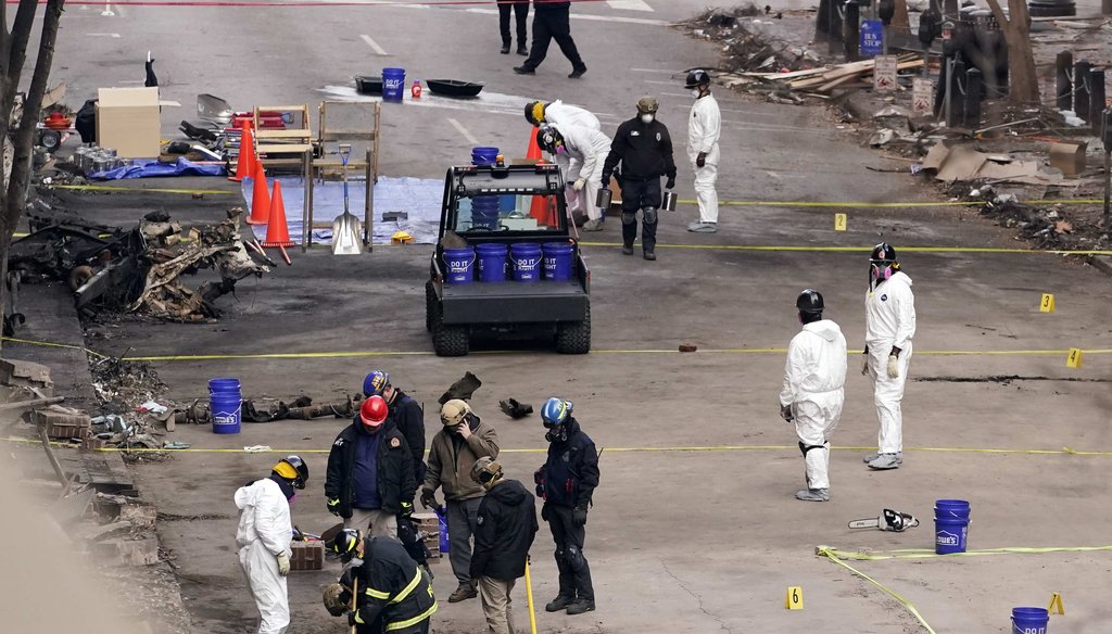 FBI and ATF personnel examine the area involved in a Christmas Day explosion Dec. 29, 2020, in Nashville, Tenn. (AP)