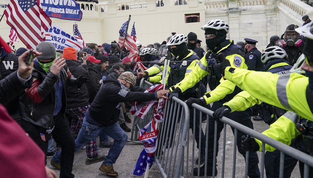 Rioters tried to break through a police barrier on Jan. 6, 2021, at the Capitol in Washington. (AP)
