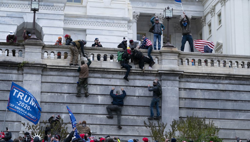 Supporters of former President Donald Trump climb the west wall of the the U.S. Capitol on Jan. 6, 2021, in Washington. (AP)