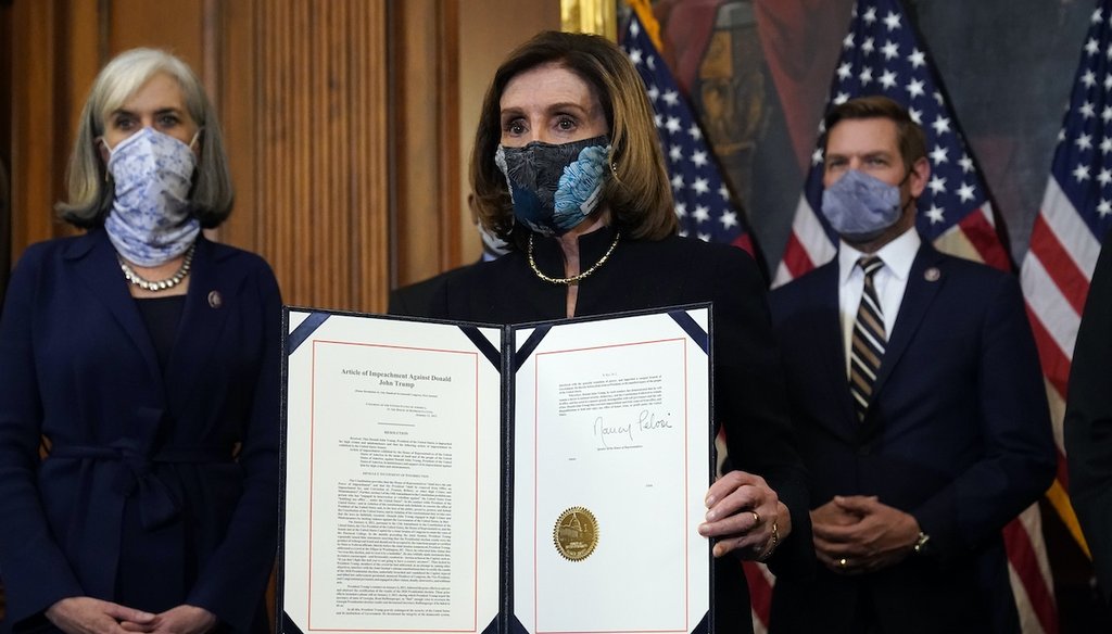 House Speaker Nancy Pelosi of Calif., displays the signed article of impeachment against President Donald Trump before transmission to the Senate on Jan. 13, 2021. (AP)