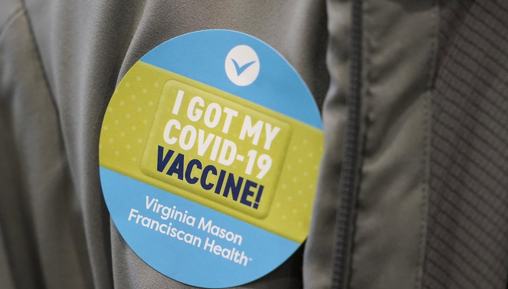 A person wears a sticker after they were given the first of two doses of the Pfizer vaccine for COVID-19, on Jan. 24, 2021, at a vaccination clinic set up in an Amazon.com facility in Seattle. (AP)