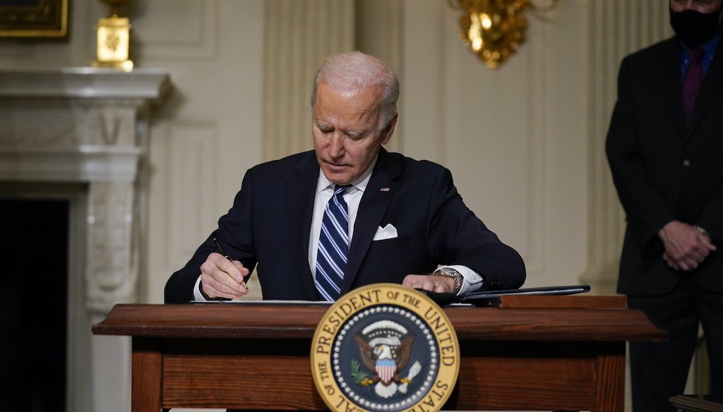 President Joe Biden signs an executive order on climate change, in the State Dining Room of the White House on Jan. 27, 2021, in Washington. (AP)