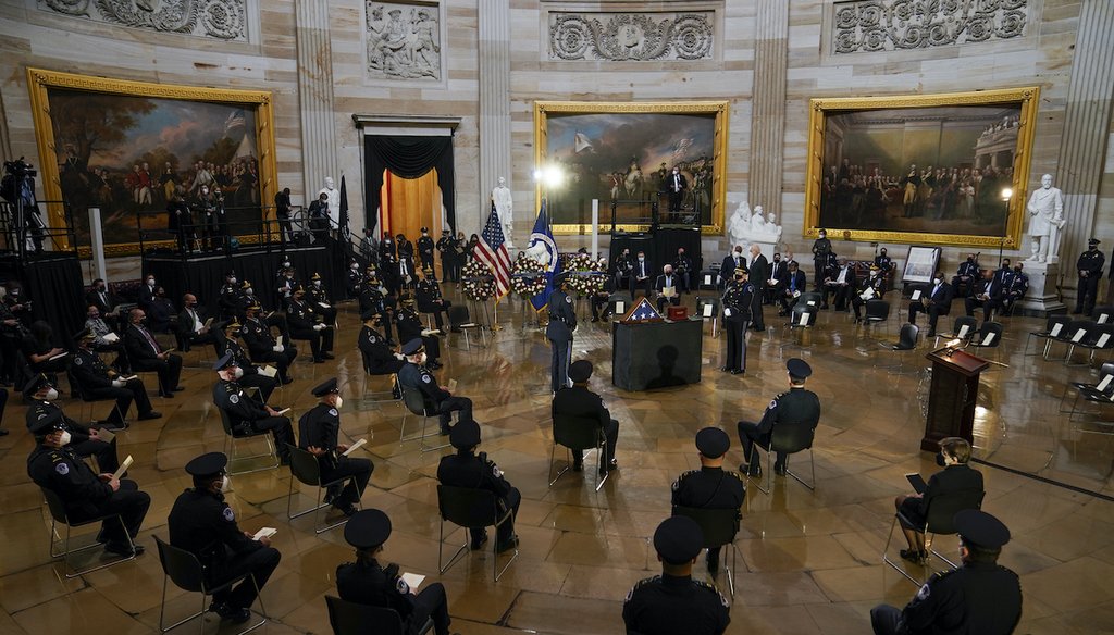 U.S. Capitol Police officers and other guests sit during a ceremony memorializing U.S. Capitol Police officer Brian Sicknick, as an urn with his cremated remains lies in honor on a table in the Capitol Rotunda on Feb. 3, 2021, in Washington. (AP/Freeman)